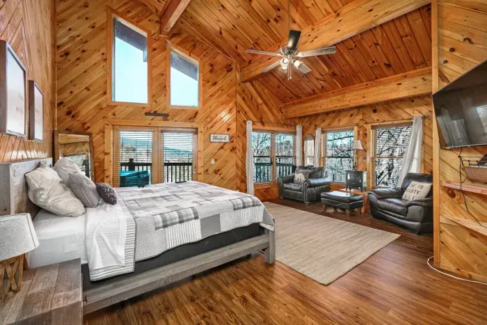 Master bedroom with king bed, seating area, TV, and amazing views. A second queen bed has been added to this room 