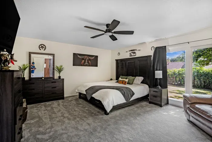 Spacious king bedroom with backyard access and plenty of natural light