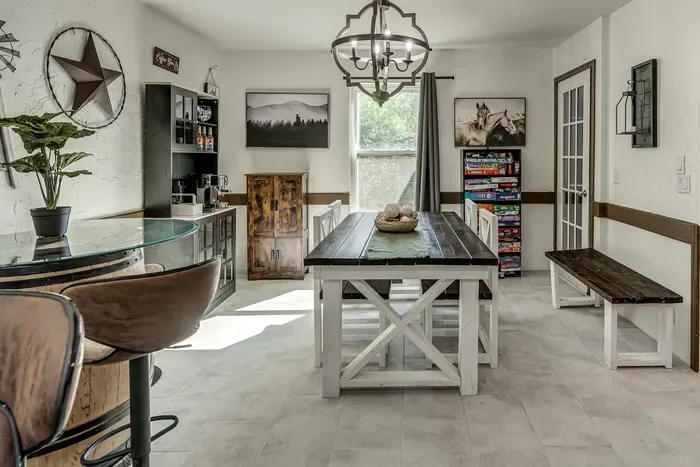 Bright farmhouse dining space with game shelf and stylish rustic charm