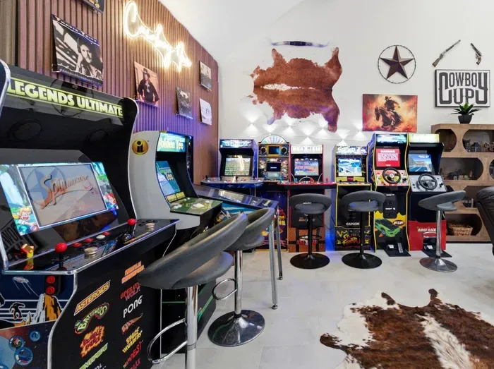 Retro arcade game room with western flair and bar seating