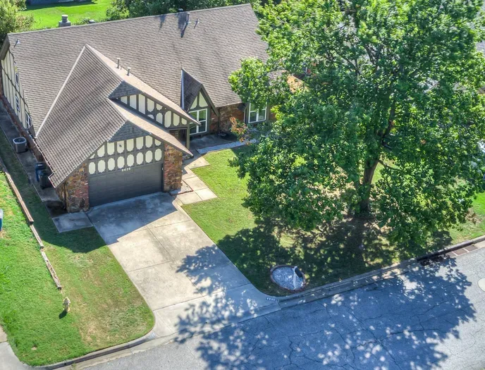 Charming Tudor-style home with shaded yard and great curb appeal