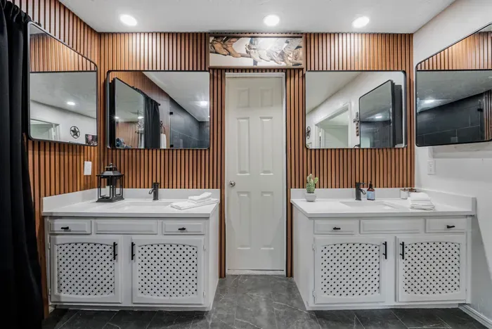 Stylish double-vanity bathroom with designer wood accents