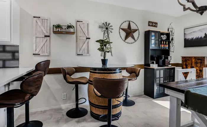 Rustic dining nook with barrel table and cozy coffee station