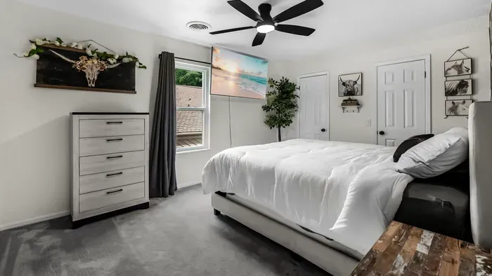 Bright, modern bedroom with plush bedding and stylish decor