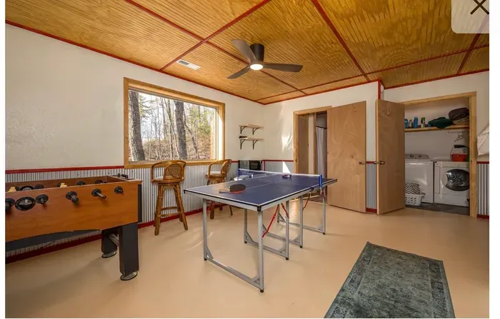Sunny game room with ping pong, foosball + in-unit laundry