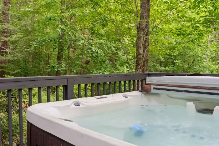 Private hot tub on a serene wooded deck retreat