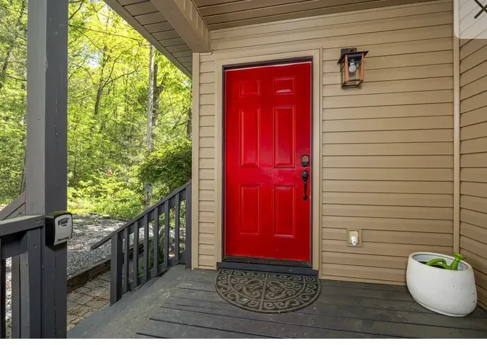 Charming red-door entry with easy self check-in and forest views