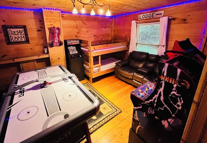 Game room with 3 arcades, ridge racer, air hockey and streaming big screen TV