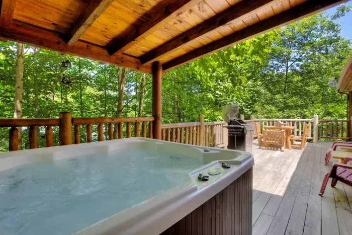 Covered hot tub with outdoor BBQ and seating 