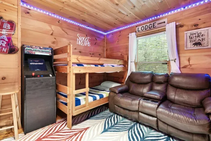 Twin bunks in the game room with LED lights 