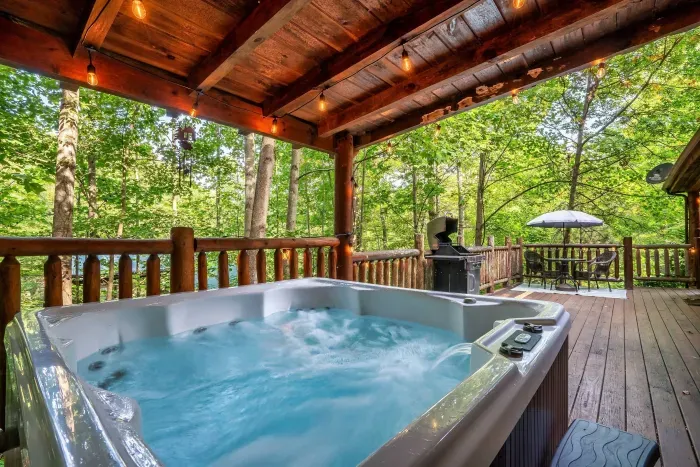 Covered 6 person hot tub, outdoor seating and propane BBQ