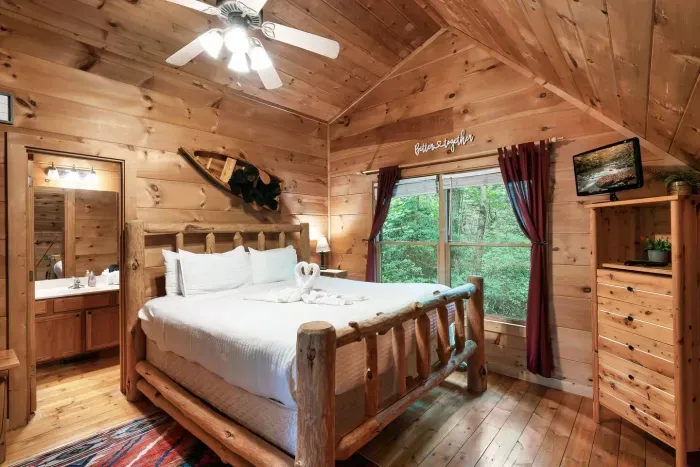 King bed in upstairs master bedroom with two small day beds for kids (yogi and boo boo)