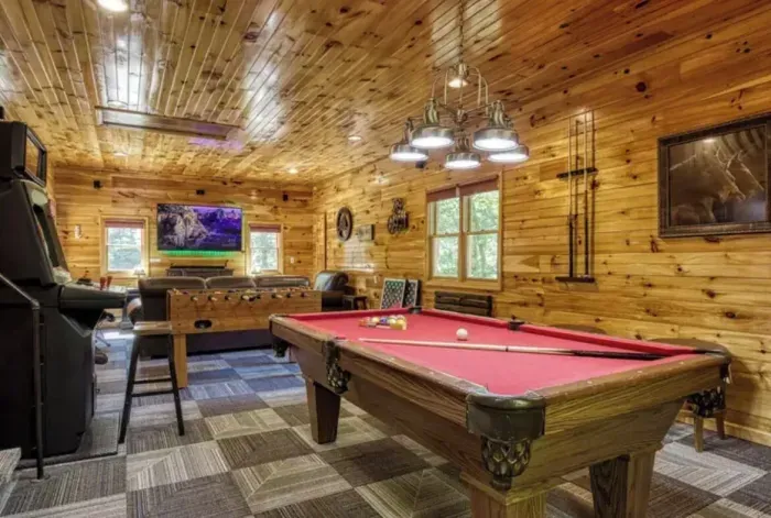 Game room pool table, multicade, foosball, poker, oak barrels, wet bar and more