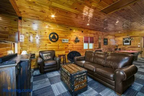 Movie area with 65' streaming TV, sound bar, leather seating