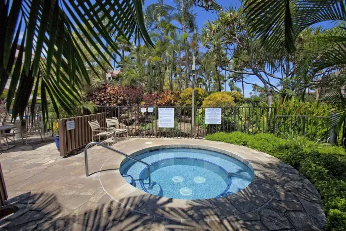 Tropical hot tub oasis with lush palms and resort-style relaxation