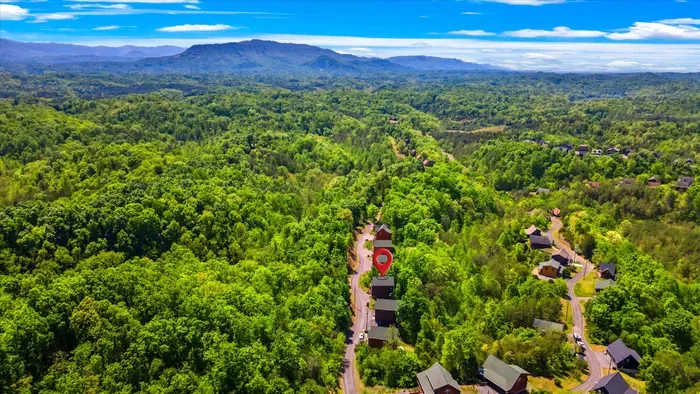 Scenic mountain cabin in lush forest—privacy, views, easy access.