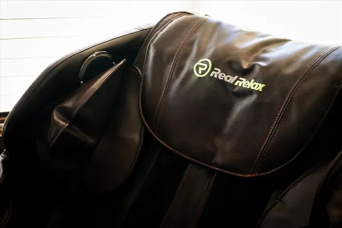 Real Relax leather massage chair—unwind and recharge in comfort.