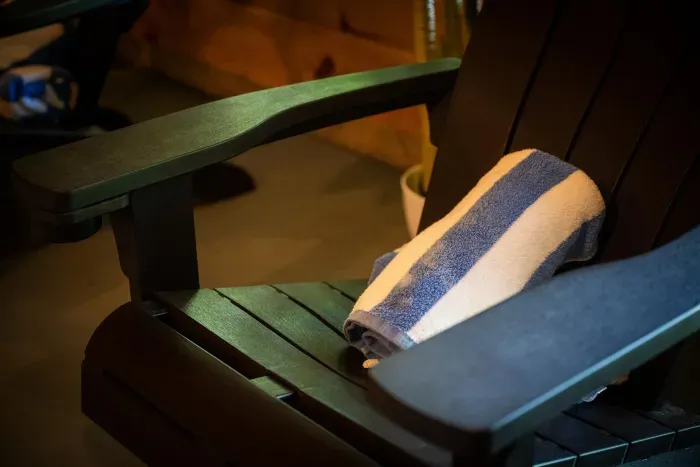 Cozy Adirondack seating with fresh towels for your patio unwind