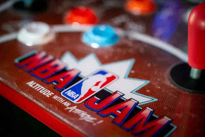 Retro NBA Jam arcade cabinet—bright buttons for epic game nights.