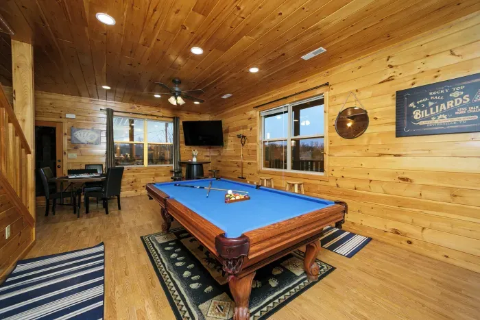 Billiards table separates two lounge areas on the second floor