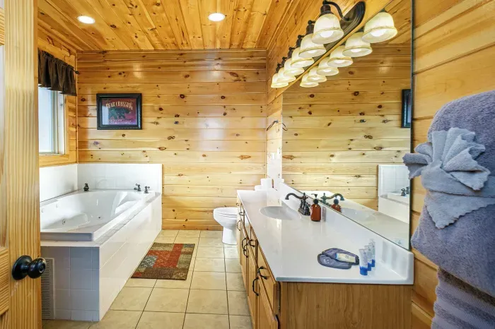 First floor bedroom with soaking tub, shower and full bathroom