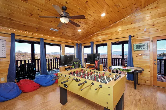 Deck access, bean bags, foosball, air hockey and wet bar/popcorn bar