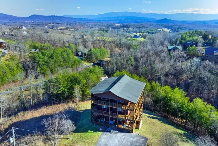 Private large parking area, paved roads, and insane views from three separate levels with wraparound decks 