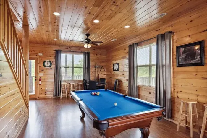 Second floor billiards, poker, high top table, two streaming TV's, & movie area
