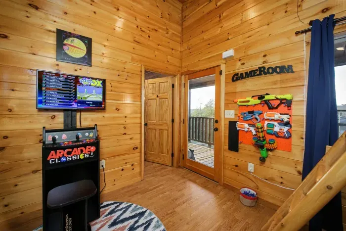 Arcade and nerf near outdoor deck access 