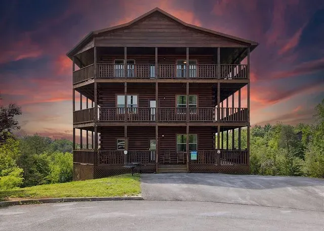 Expansive multi-level log cabin with wraparound decks and sunset views