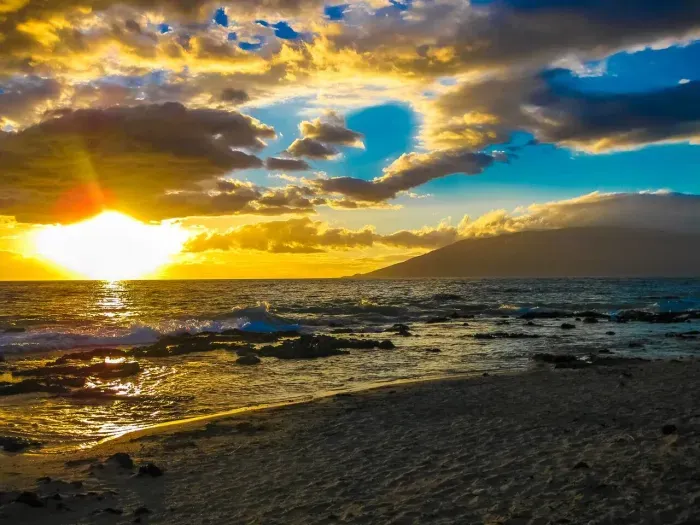 Sunset view from Kamaole Beach Park, just a three minute walk from the condo.