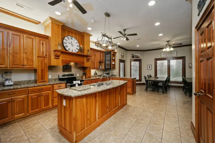 Large kitchen with granite countertops and pantry 