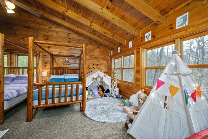 Loft area with sleeping accommodations  and play area for kids