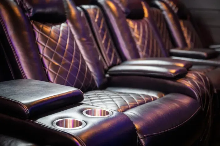 Luxury home theater recliners with plush seating and cup holders