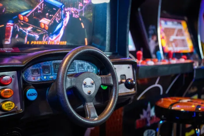 Retro arcade room with racing games for a fun, nostalgic guest experience