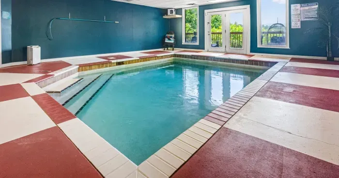 Bright indoor pool with natural light and year-round relaxation