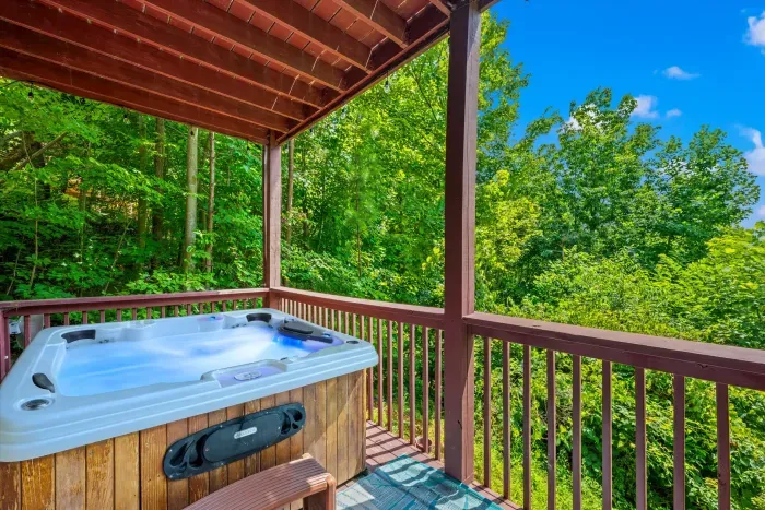 Private covered hot tub deck with peaceful forest views