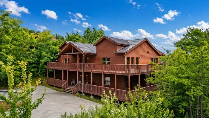 Spacious wooded cabin with wraparound decks and a private retreat feel