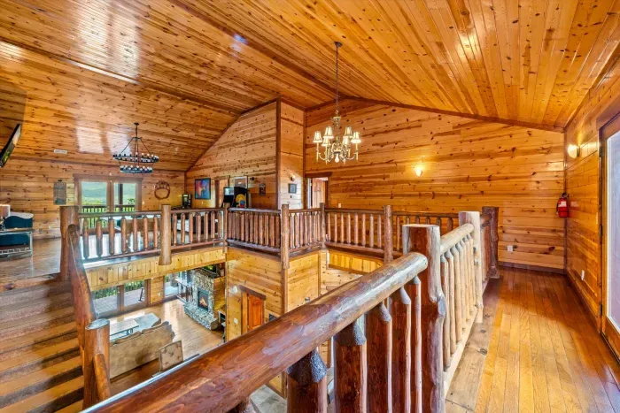 Spacious loft with vaulted wood ceilings and rustic cabin charm