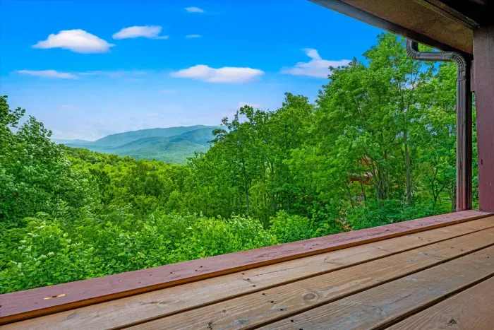 Covered deck with serene mountain views and peaceful forest surroundings