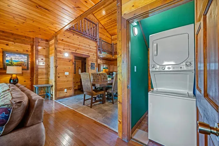 Rustic cabin interior with lofted ceilings and in-unit washer/dryer