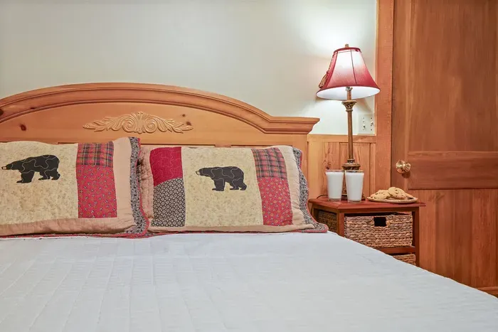 Cozy rustic bedroom with warm wood accents and charming cabin décor