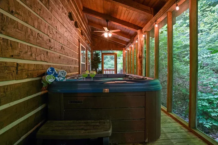 Private screened porch with hot tub and peaceful wooded views