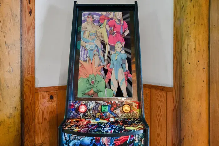 Arcade-style gaming machine for a fun, nostalgic guest experience