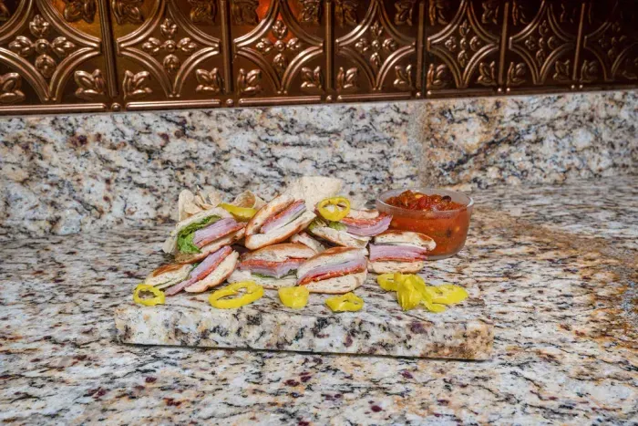 Granite prep space with designer backsplash, perfect for snacks and hosting