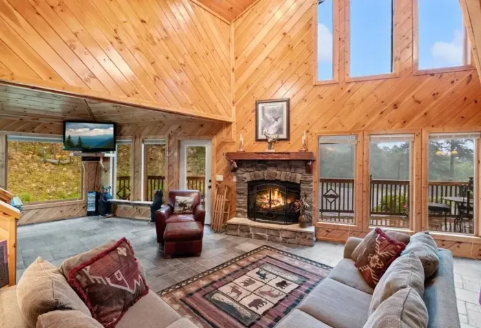 Vaulted ceilings, natural light, fireplace and billiards area with arcade 