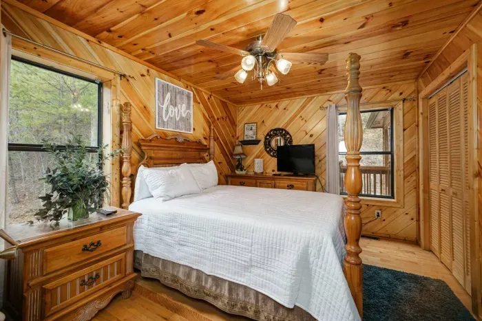 Downstairs bedroom with king bed and en suite bathroom access 