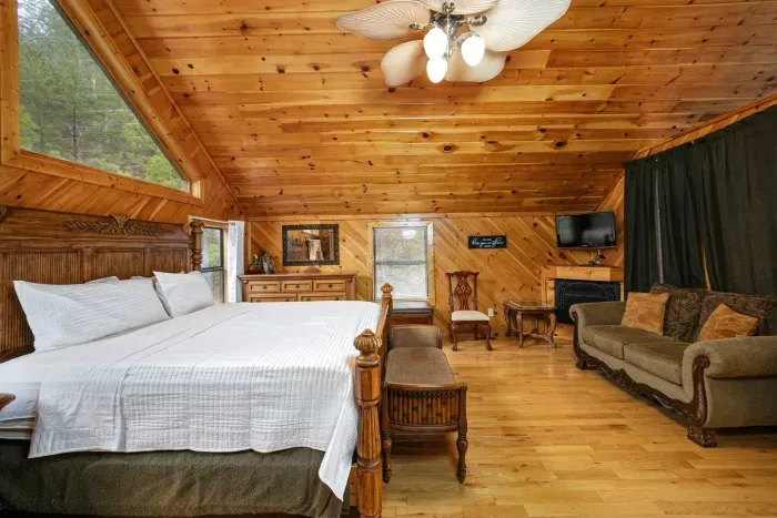 King bed, fireplace, and seating area 