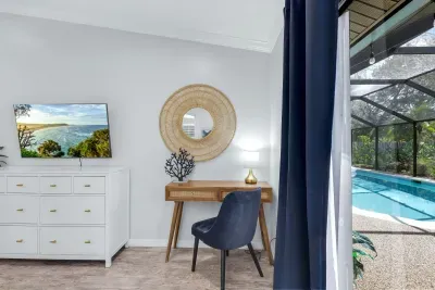 Comfortable and stylish workspace with a view of the pool — ideal for working remotely or unwinding with a good show.