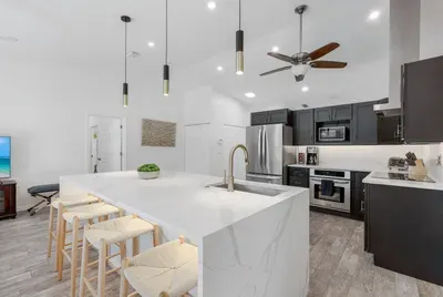Bright, modern kitchen fully equipped with all the essentials—perfect for cooking and gathering during your stay.